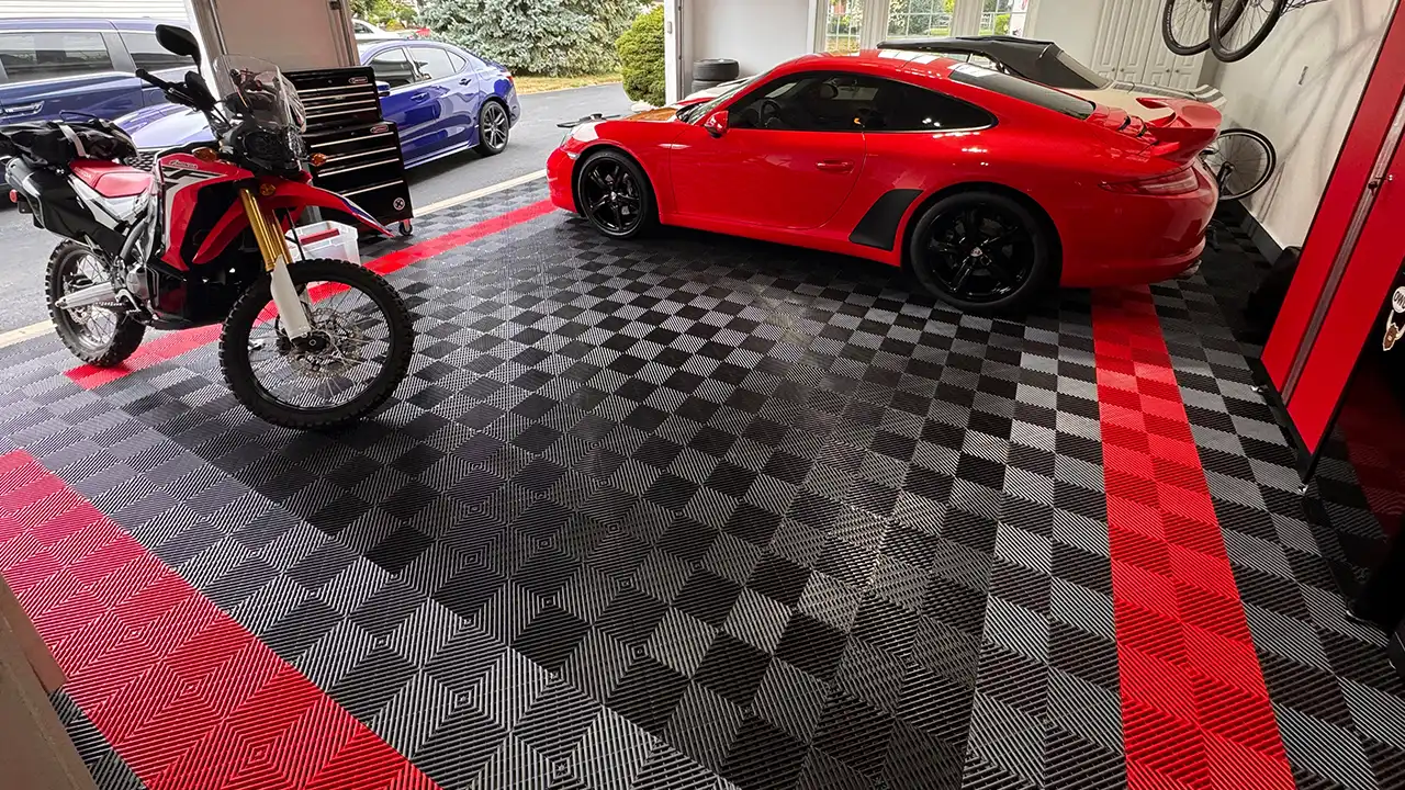 Adventure Bike and a Porsche in a grage with free-flow tiles
